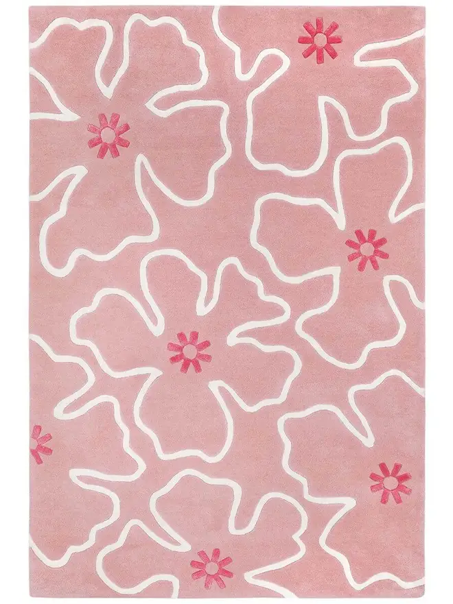 Hibiscus Hand Tufted Rug, a colourful rug on a plain surface. 