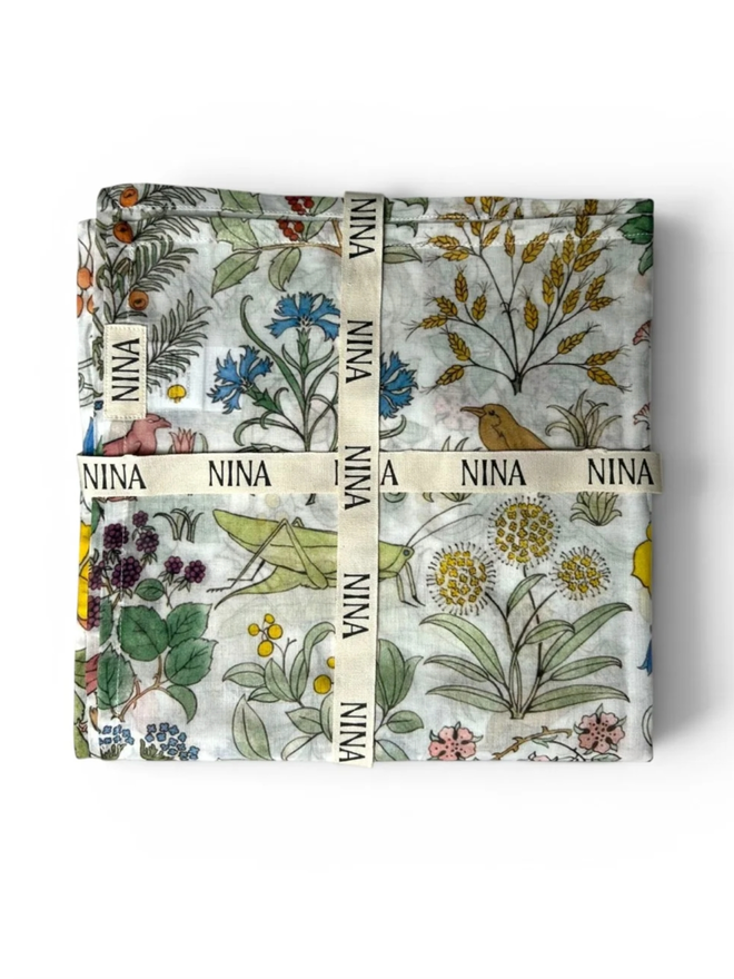 Apothecary’s Garden Muslin. A floral patterned muslin, folded.