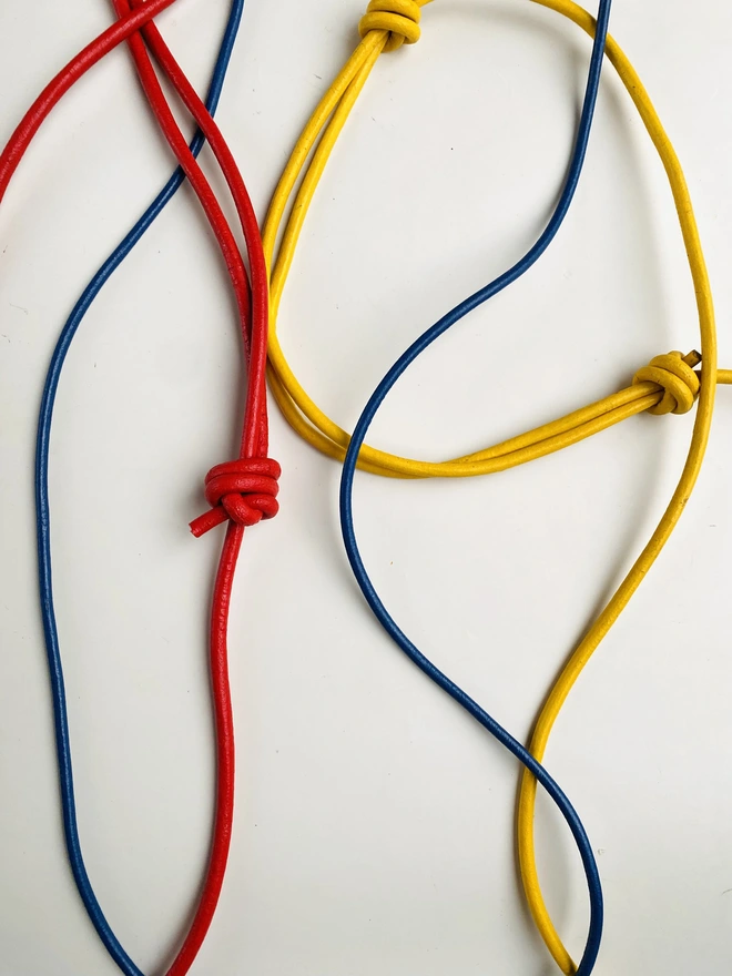 Leather phone bag with colourful strap