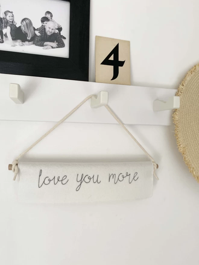 Love You More Felt Embroidered Banner on hooks with picture and number 4