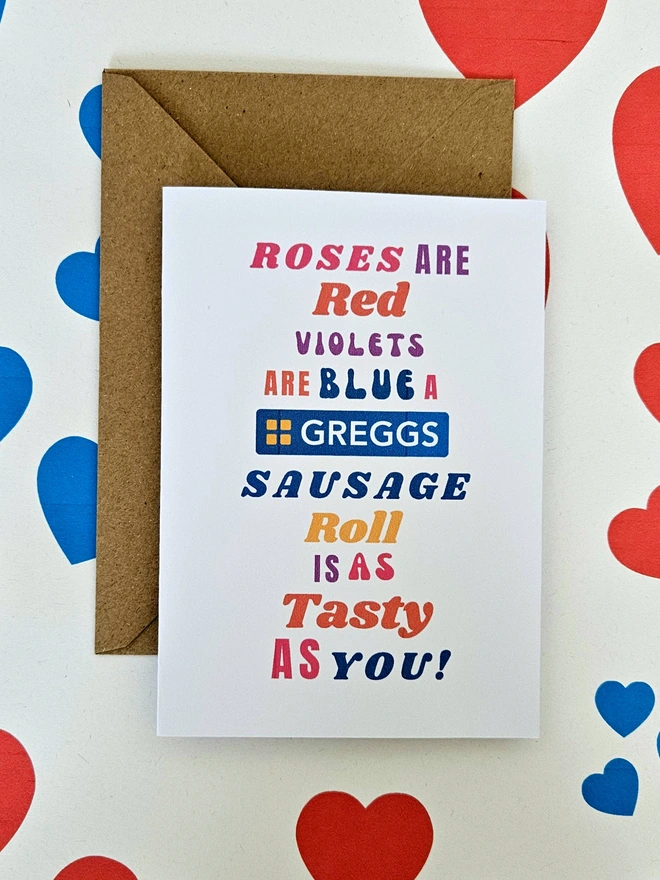 A humorous valentine greeting card that says rose are red violets are blue a greggs sausage roll is a tasty as you in colourful text in different fonts