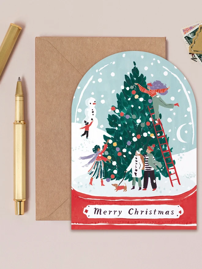 Snowglobe Christmas Card by Sister Paper Co with a kraft envelope