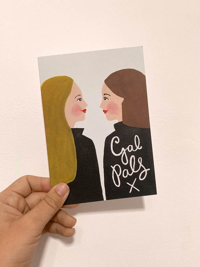 Gal pals card in hand