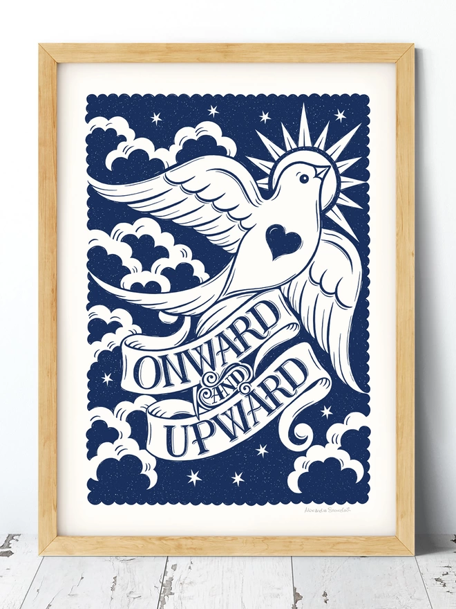 blue and white onward and upward print in wood frame