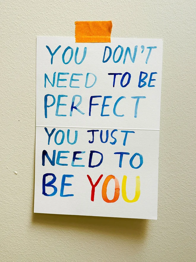 A handwritten note in watercolour on 300gsm recycled scrap card that reads "You Don't Need To Be Perfect You Just Need To Be You"