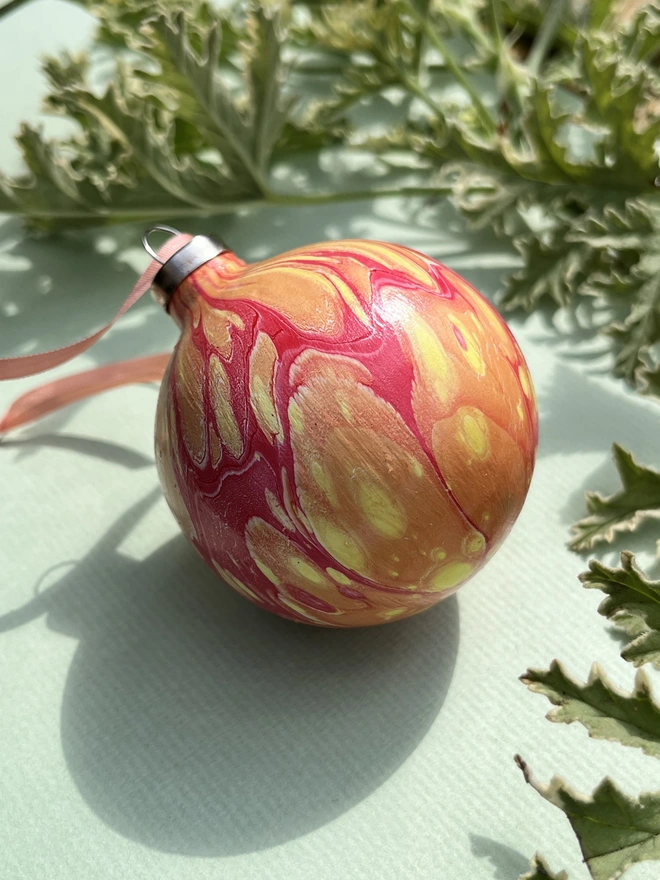 Hand-marbled round ceramic Christmas bauble