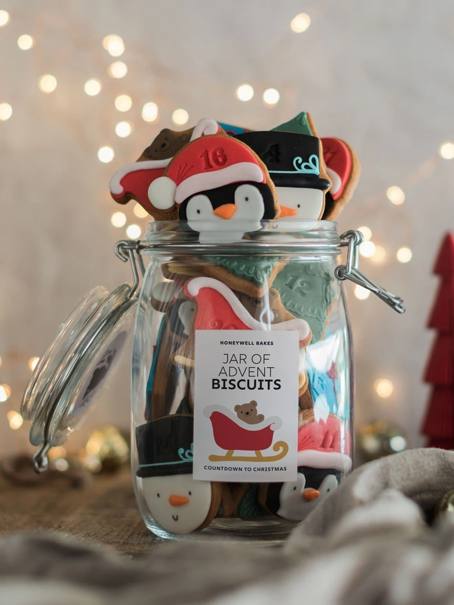 Personalised Christmas Advent Calendar Biscuit Jar. Festive biscuits in a clip top jar with a personalised label