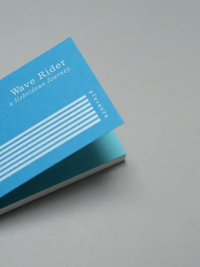 Wave Book, being opened on table. 