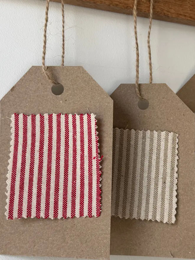 Striped Embroidered Christmas Stocking. A selection of plain and patterned linens on a swatch