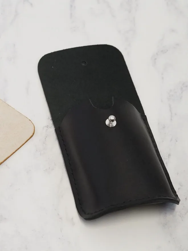 black leather playing card sleeve