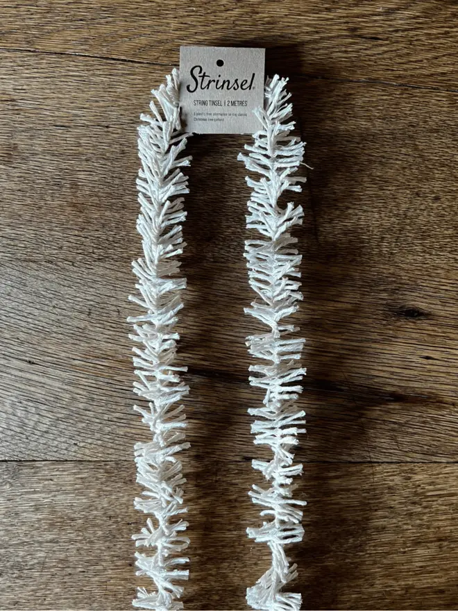 Original Strinsel AKA Jute string tinsel on an oak table