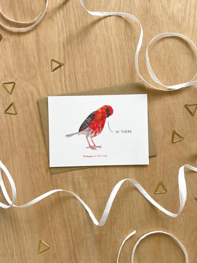  a greetings card featuring an illustration of a red fody with the text hi there”