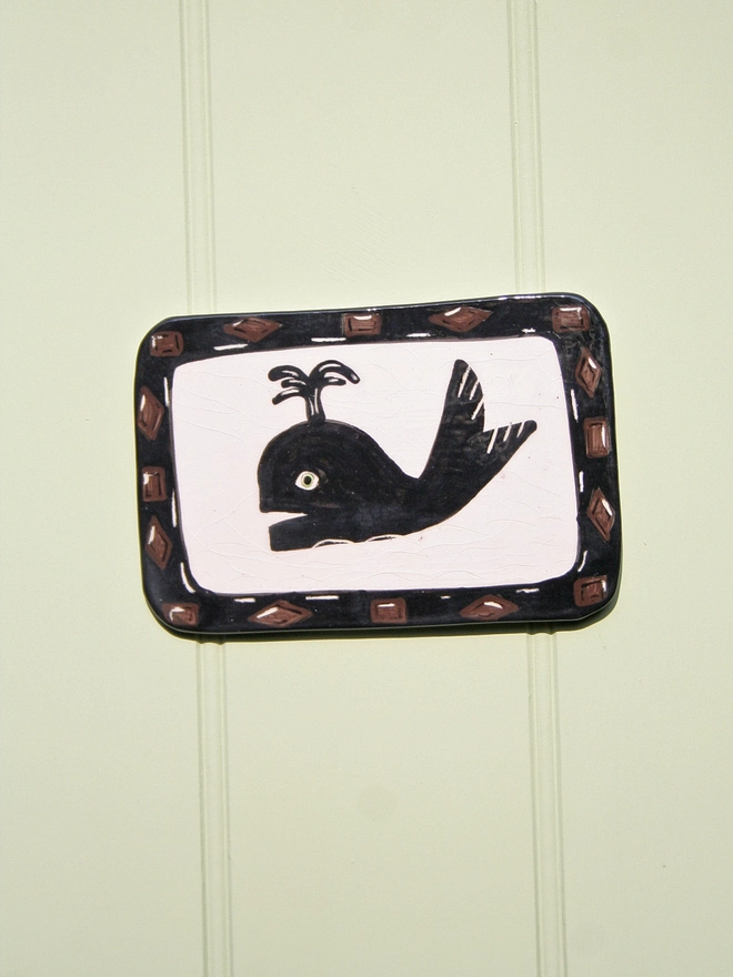 ceramic wall art decorative seaside silhouette of foxy rocks, Captain Netty and Whale  