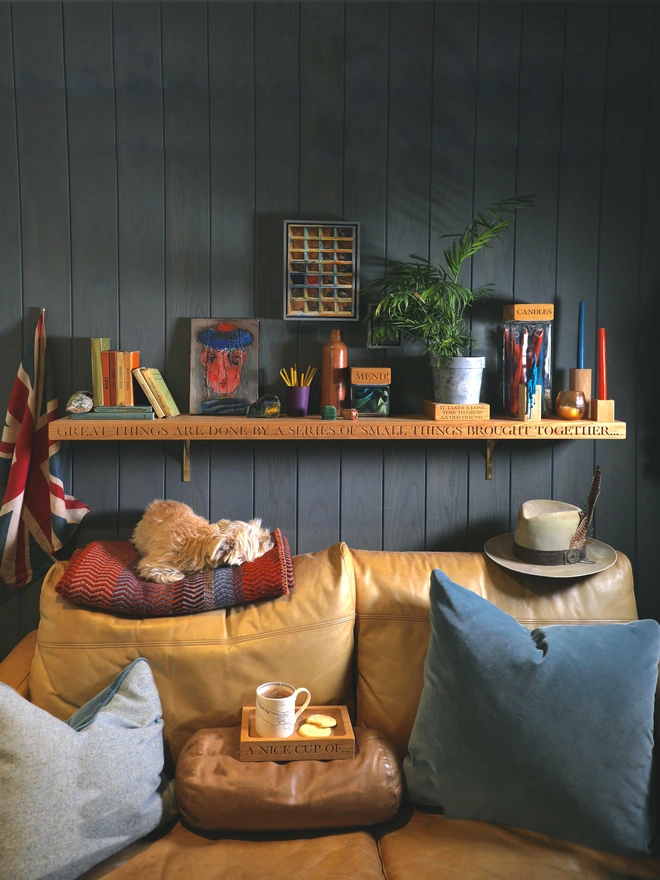 Shelf with treasures above a sofa