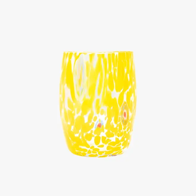 round tumbler glass with yellow splotches
