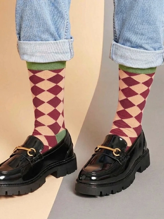Women's Organic Cotton Ankle Socks Packs (Sets Of 3), a person wearing a pair of colourful patterned socks. 