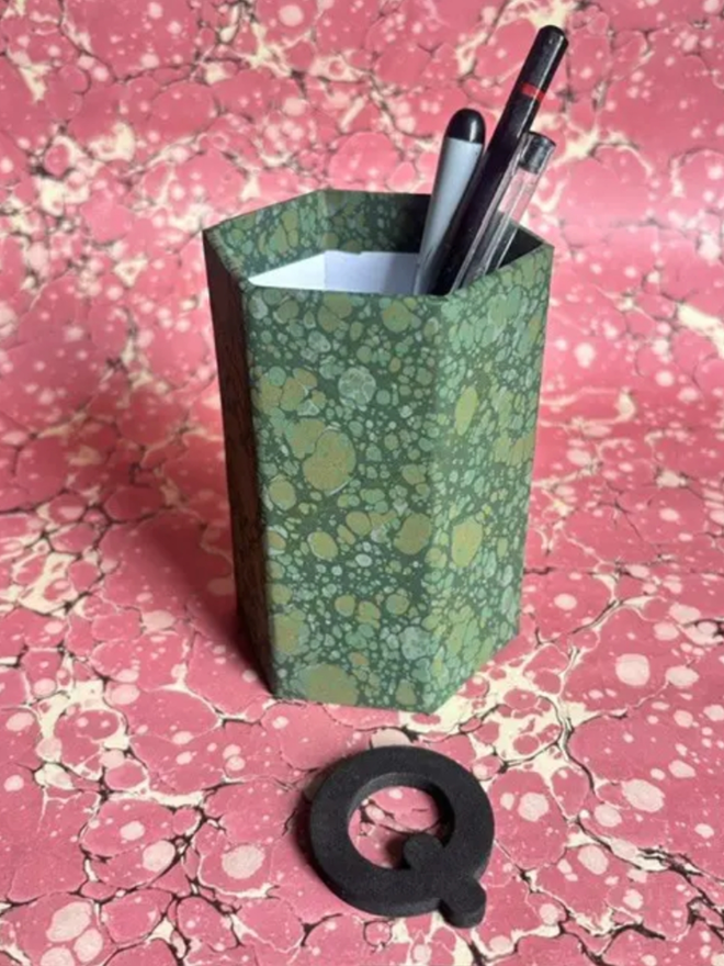 Pen Pot. A pen pot in Q