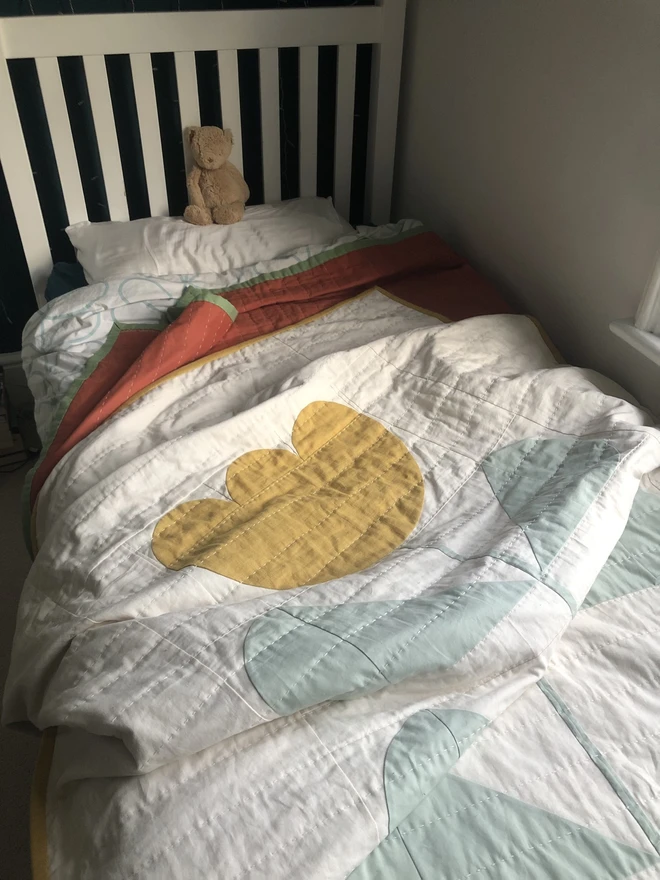 Grow & Bloom Yellow Single Quilt. Yellow flower quilt on kids bed.