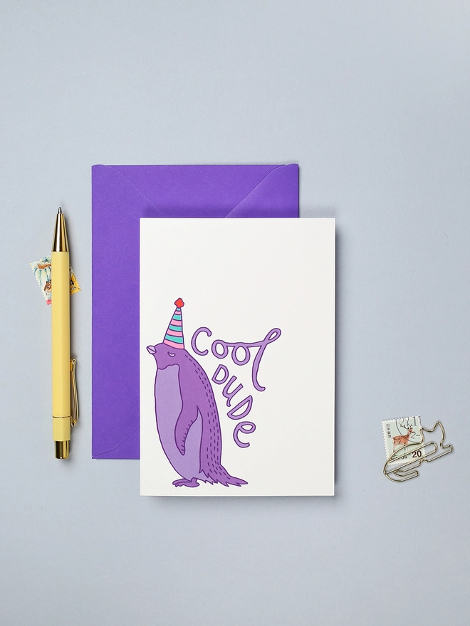 Bright and colourful birthday card featuring a cool penguin 