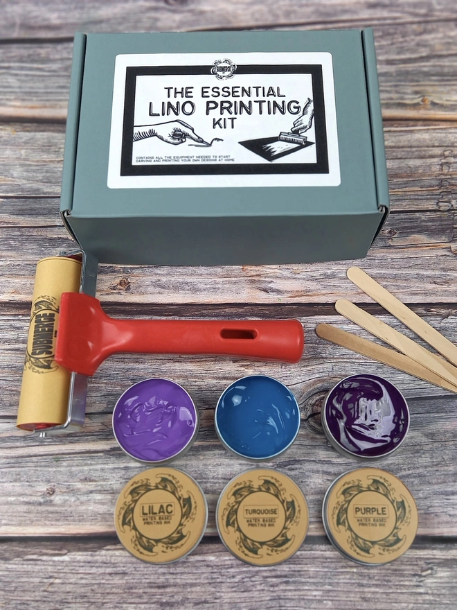 Essentials Lino Printing Craft Kit, utensils and inks unpacked on table. 