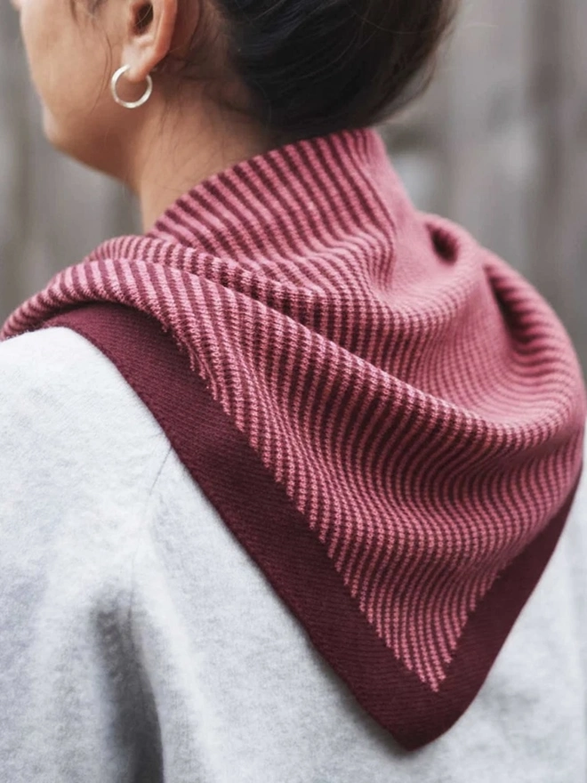 Lambswool Triangle Neck Scarf, a woman wearing a colourful neck scarf outdoors. 