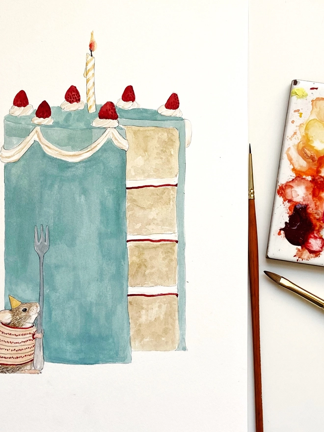 Illustration of a mouse next to a big blue cake with paint palette and brushes