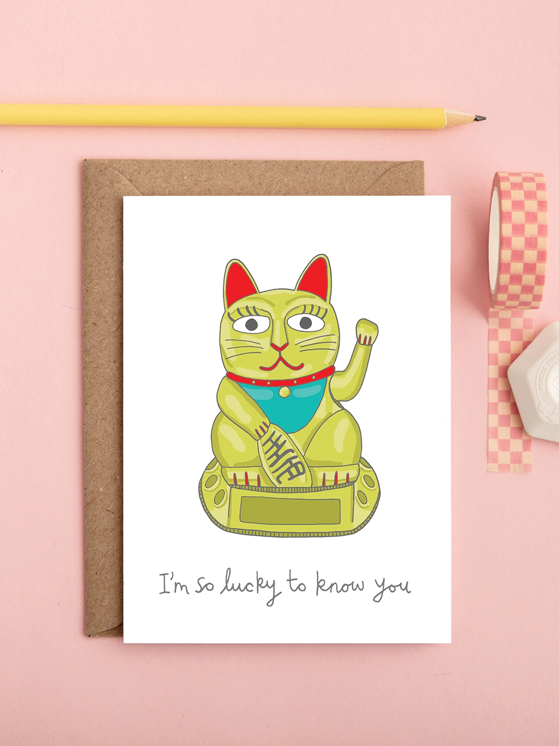 Funny friendship or greeting card featuring a waving Chinese cat 