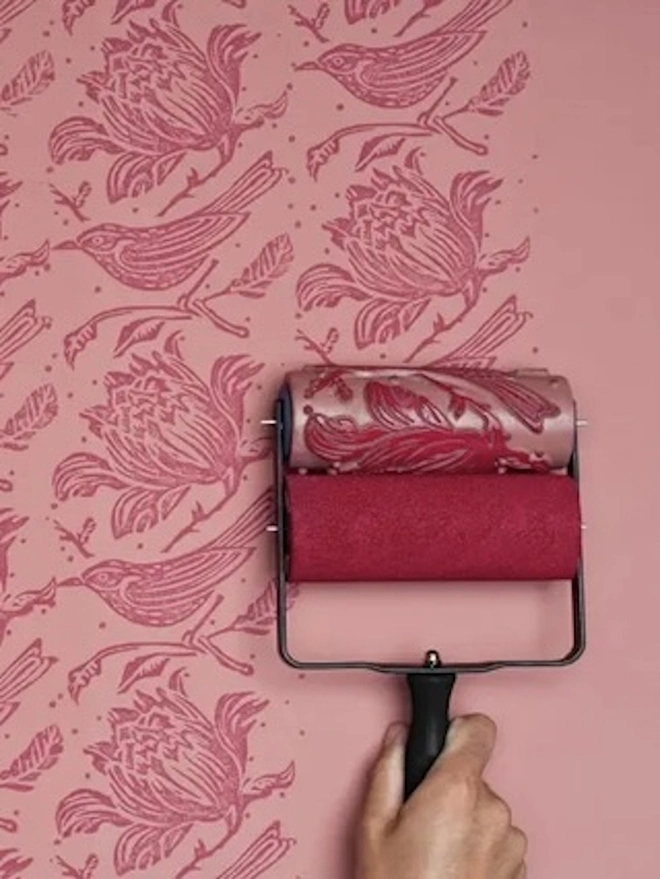 Flock Patterned Paint Roller, painting wall with pink paint. 