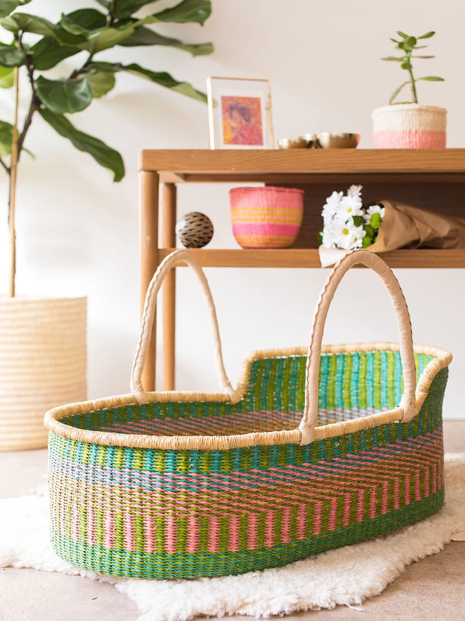 pink, green and blue moses basket styles with other woven baskets