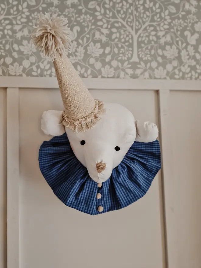 Bear Head Nursery Decoration, a bear decoration sitting against a wall in a child's decorated bedroom. 
