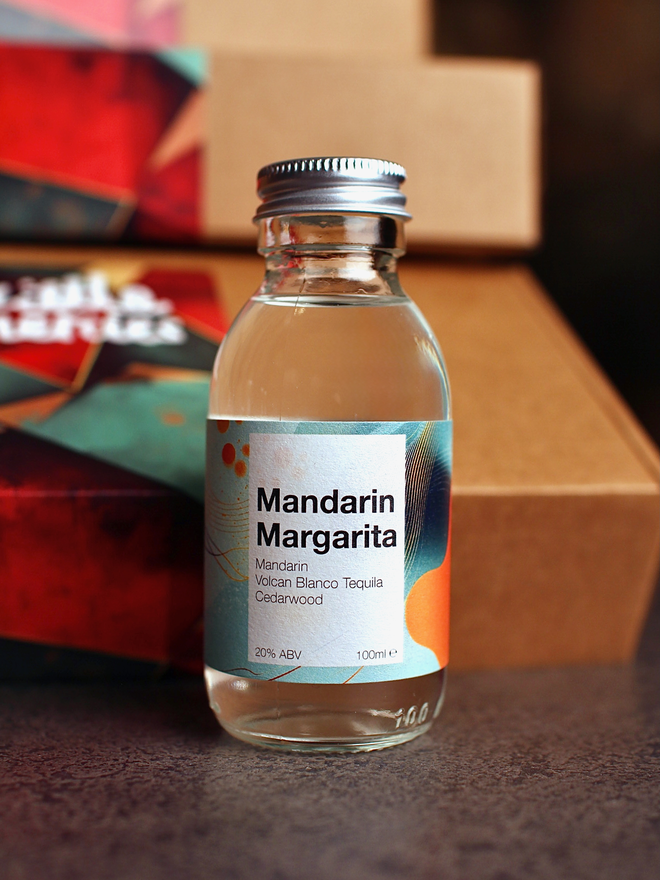 Mandarin Margarita against Christmas gift box