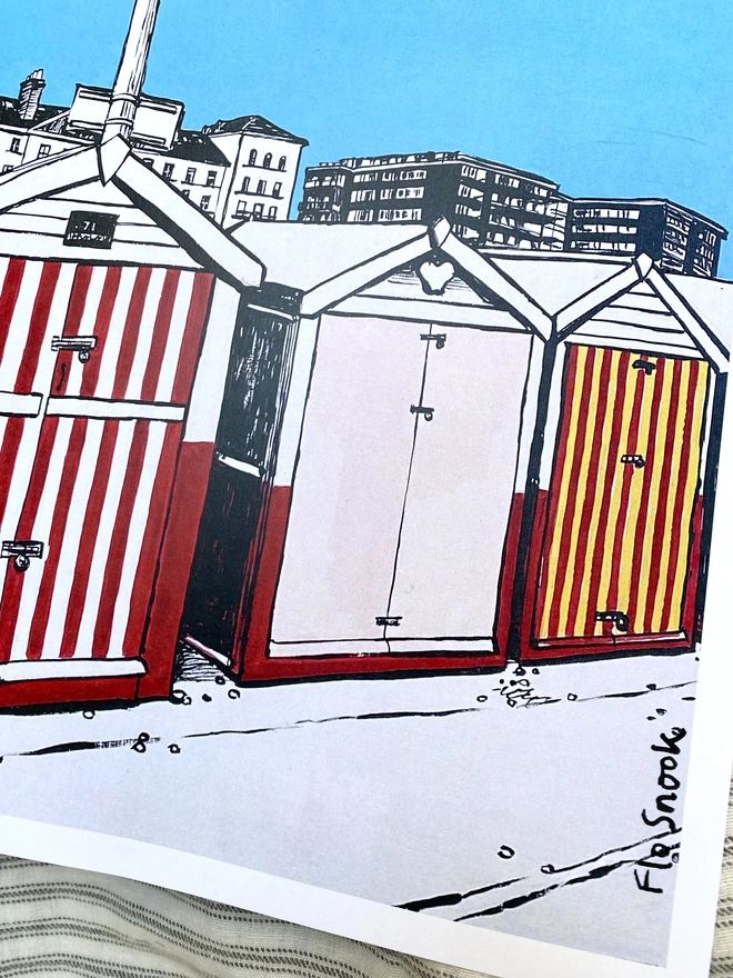 blue and red print of brighton hove beach huts