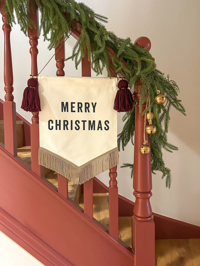 Merry Christmas festive fabric banner decoration with burgundy red yarn tassels and gold bullion trim