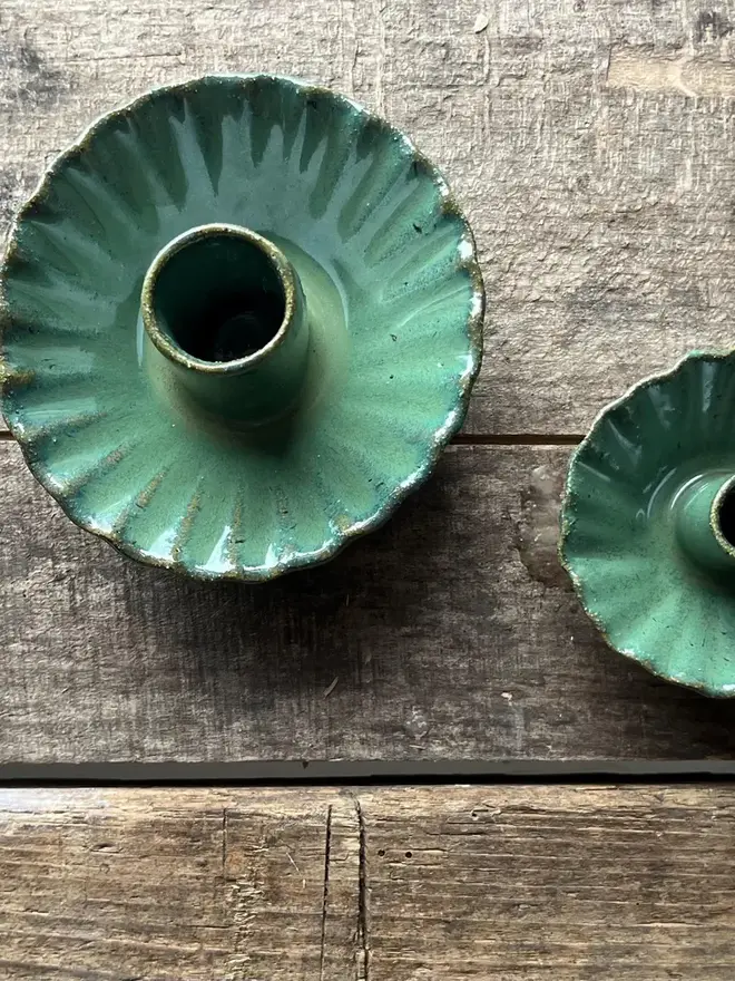 Handmade Green Ceramic Candlestick Holder, a pair of green candlestick holders sitting on a wooden surface. 