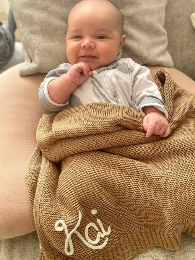 Hand-embroidered brown baby blanket