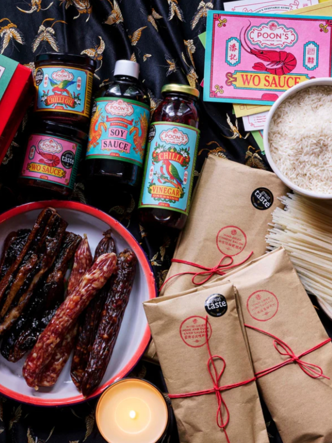 Heritage Gift Hamper. A selection of several sauces, postcards, and wind-dried meats.