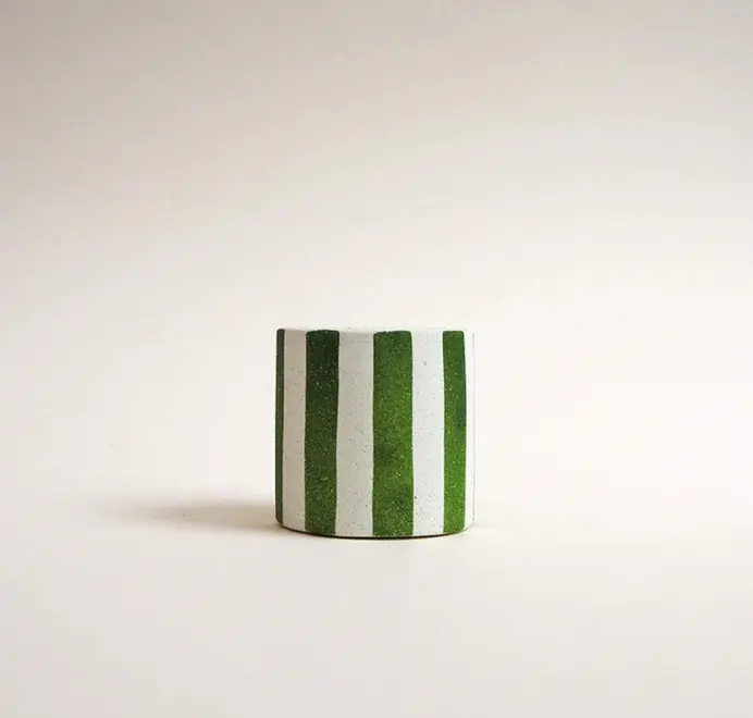 Mini Stripy Plant Pot. A white ceramic pot with vertical coloured stripes set against a plain light background.