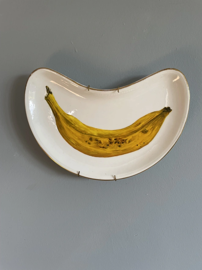 banana oil painting on vintage plate