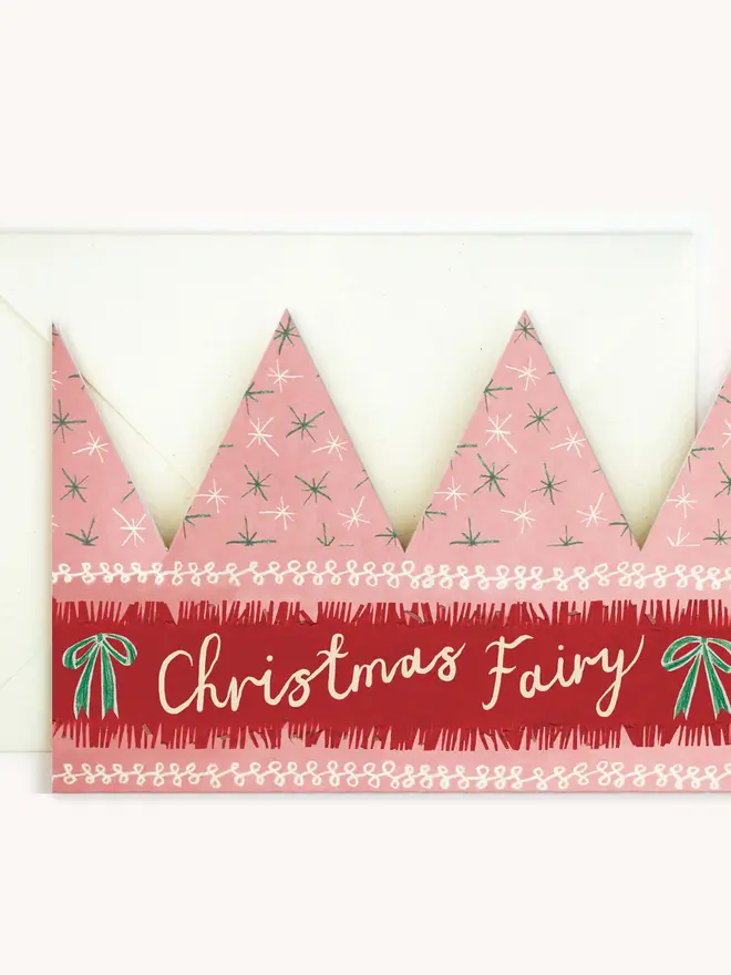 pink and red paper crown card with christmas fairy text