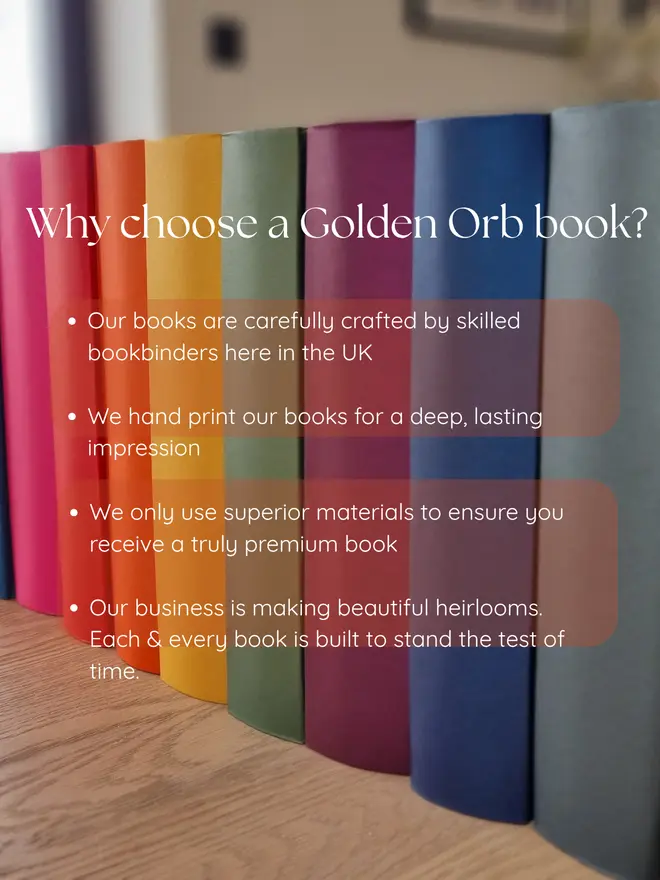A row of colourful books are lined up, with text about BeGolden handmade book craftsmanship on a wooden surface.