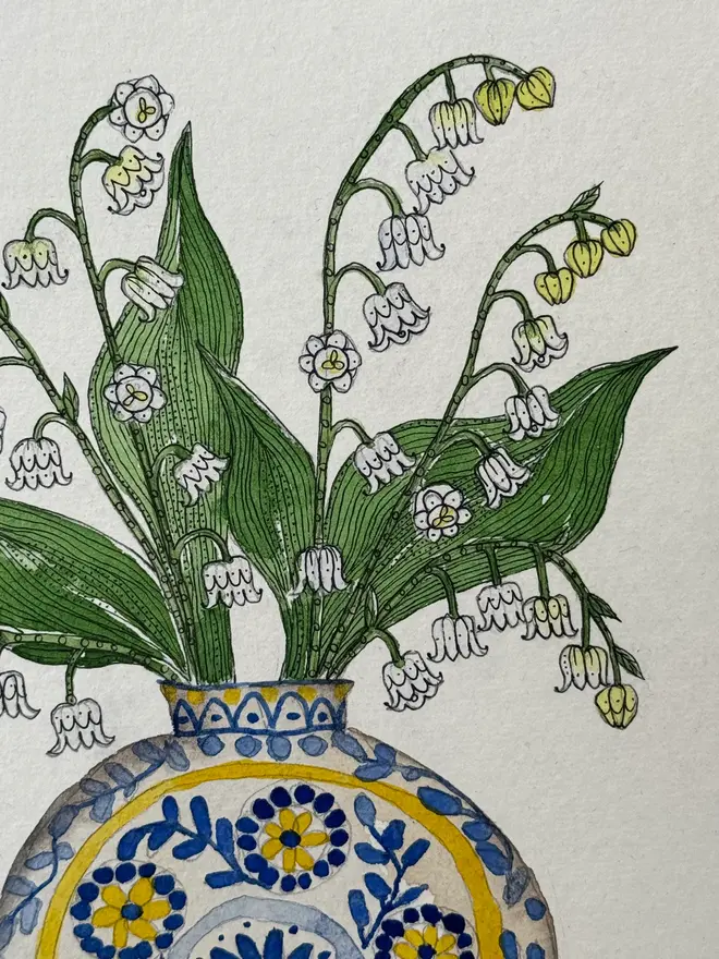 Lily of the Valley flowers in a Blue & Yellow vase