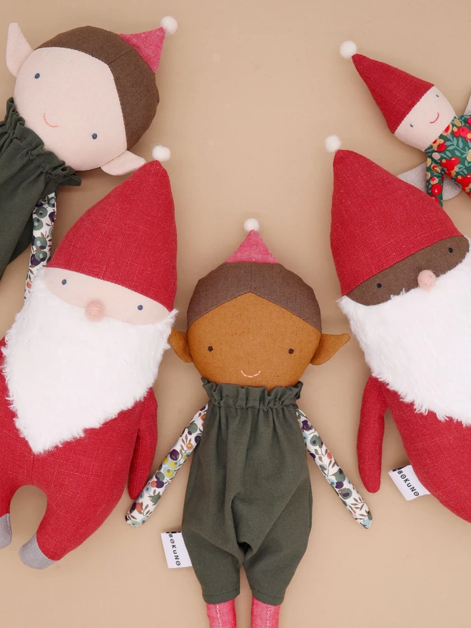 santa and elves in different skintones