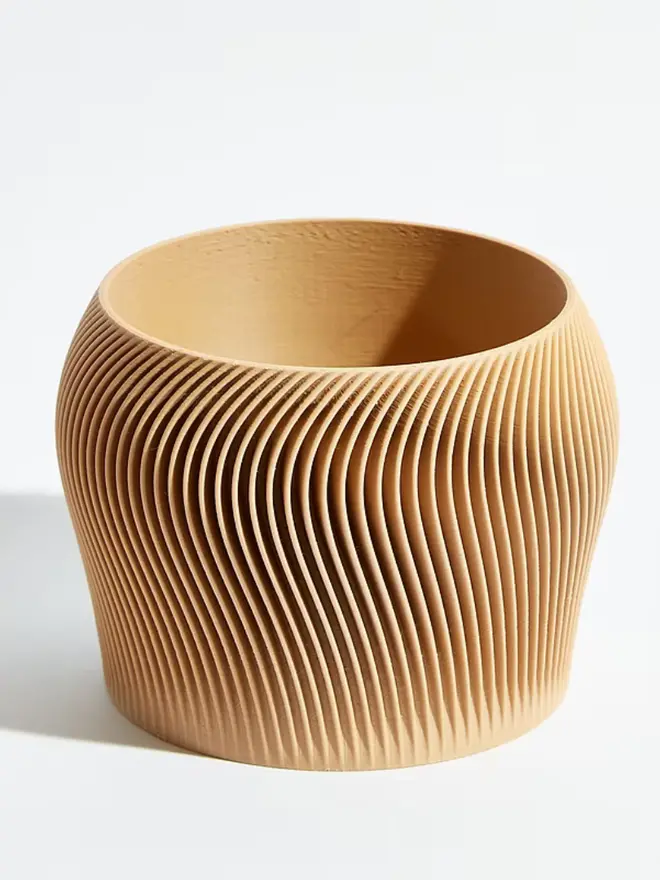 Sustainable 3D Printed Sand Beige Plant Pot, orbital design against a white background.