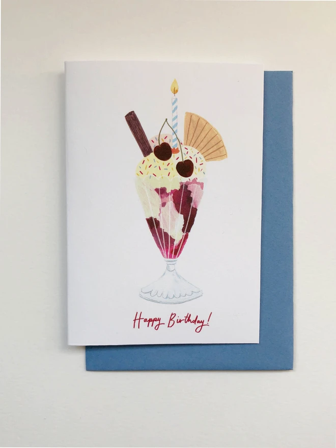 An illustrated birthday card featuring a knickerbocker glory and the message "Happy Birthday!" in red script