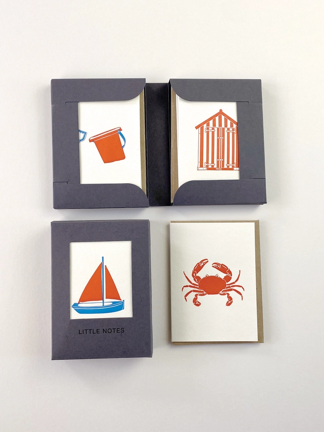 Open and closed gift boxes for little notes allowing you to see three of the four designs in one box