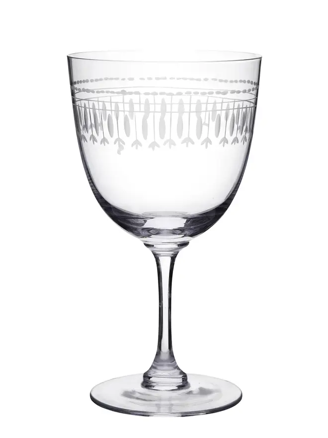 engraved oval wine glass. a wine glass with engraved ovals in a pattern.
