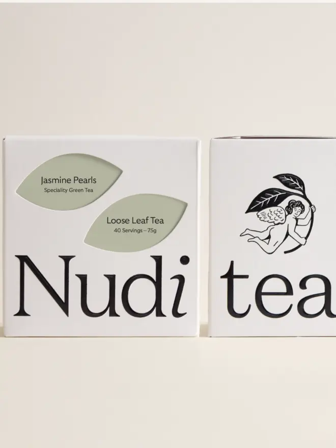 white box of jasmine tea with pale green leaf design