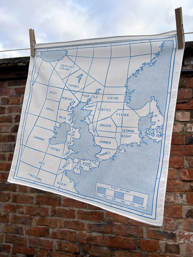 A Mr.PS Shipping Handkerchief pegged on a washing line