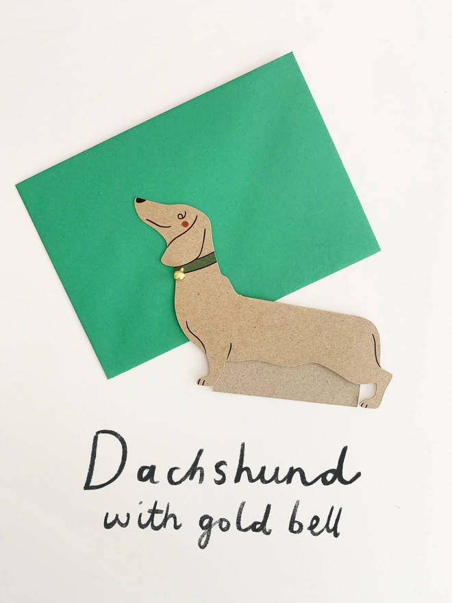 Dachshund dog shaped card with a gold bell