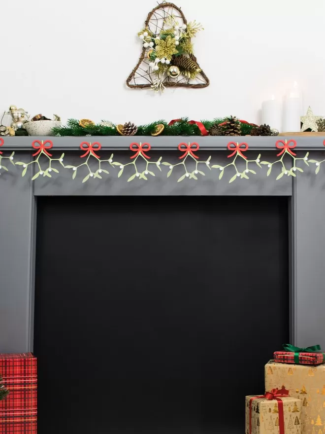 Mistletoe Christmas Bunting displayed on festive mantelpiece